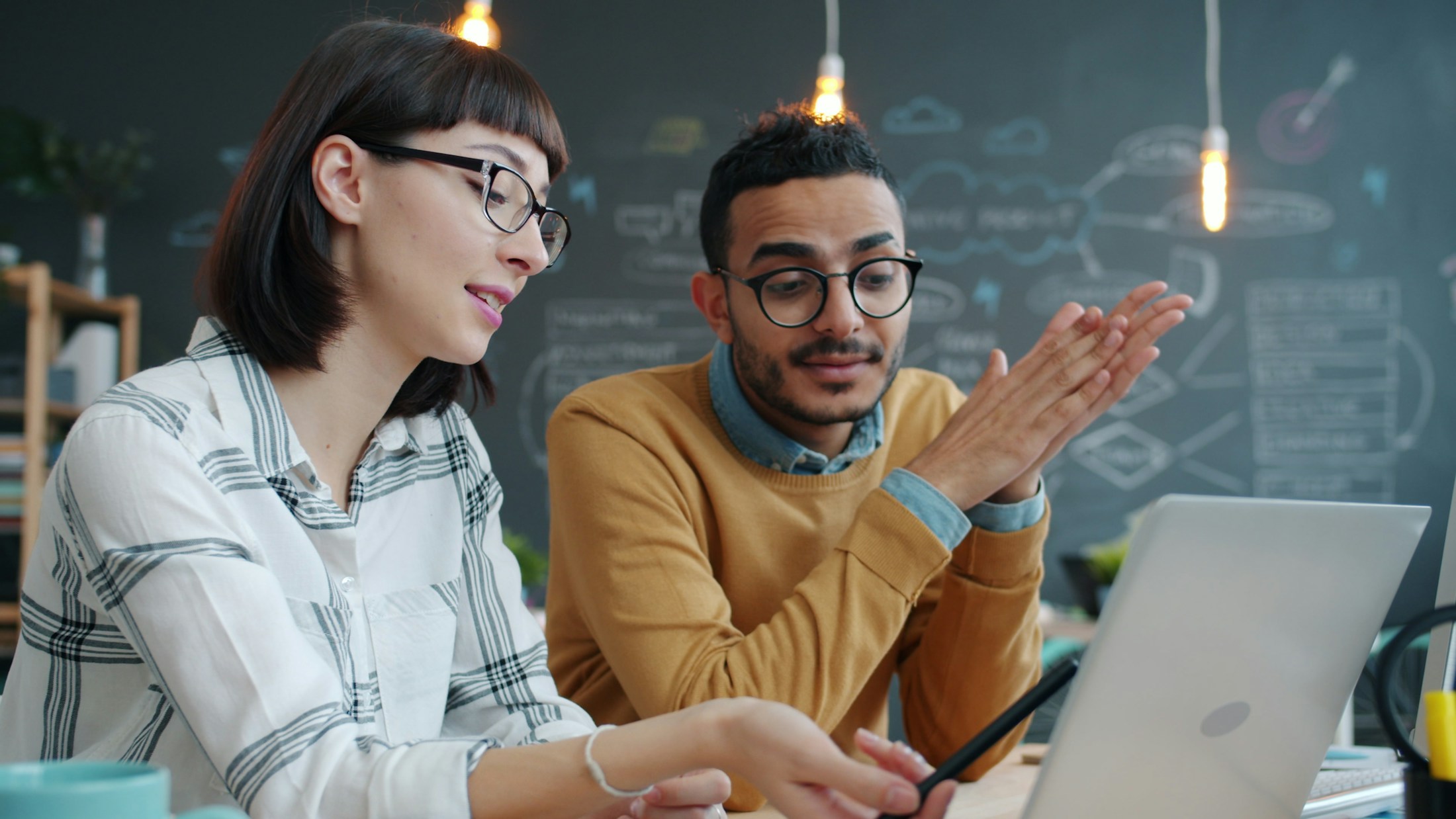 A focused product conversation in a warm studio setting